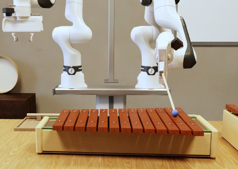 Two arms playing a xylophone