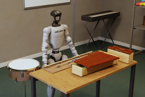 A humanoid robot at the xylophone